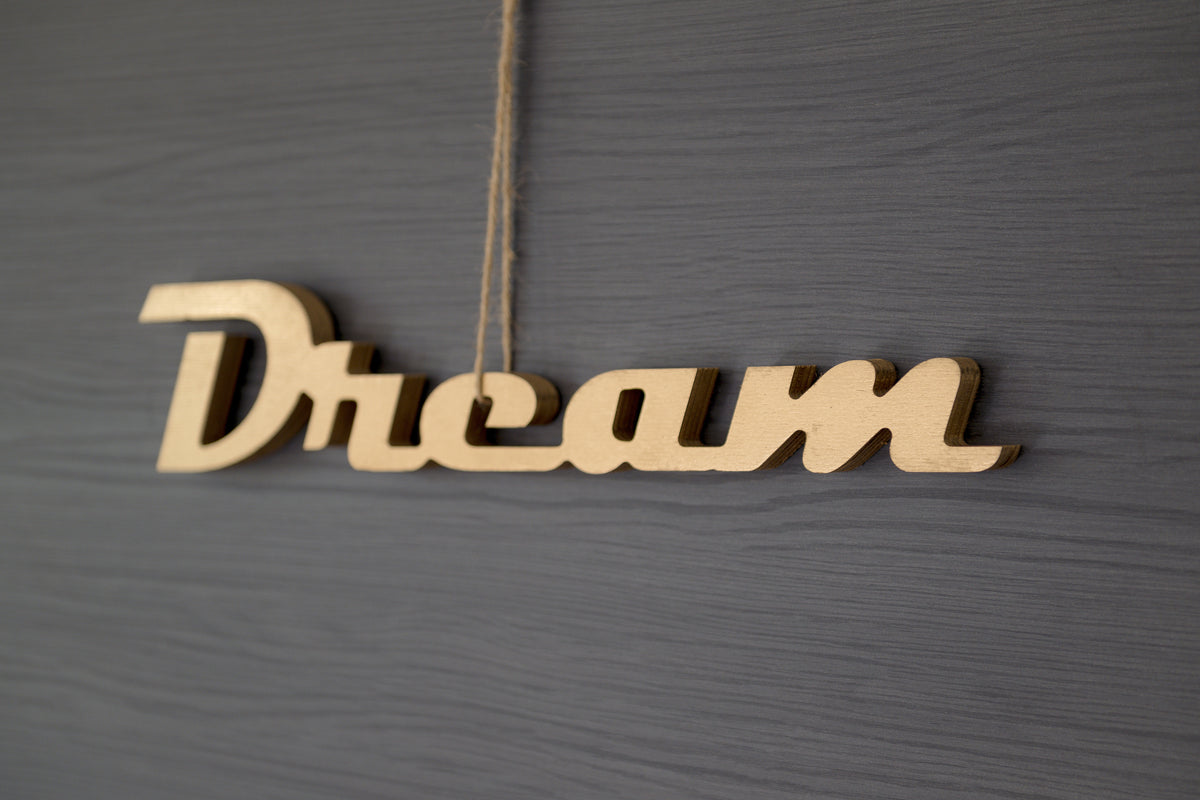 Mot décoratif Dream doré en bois peint